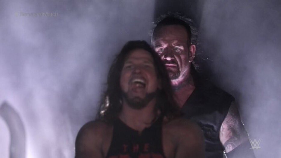 aj styles laughing with the undertaker behind him: the february fix, and version 2.0